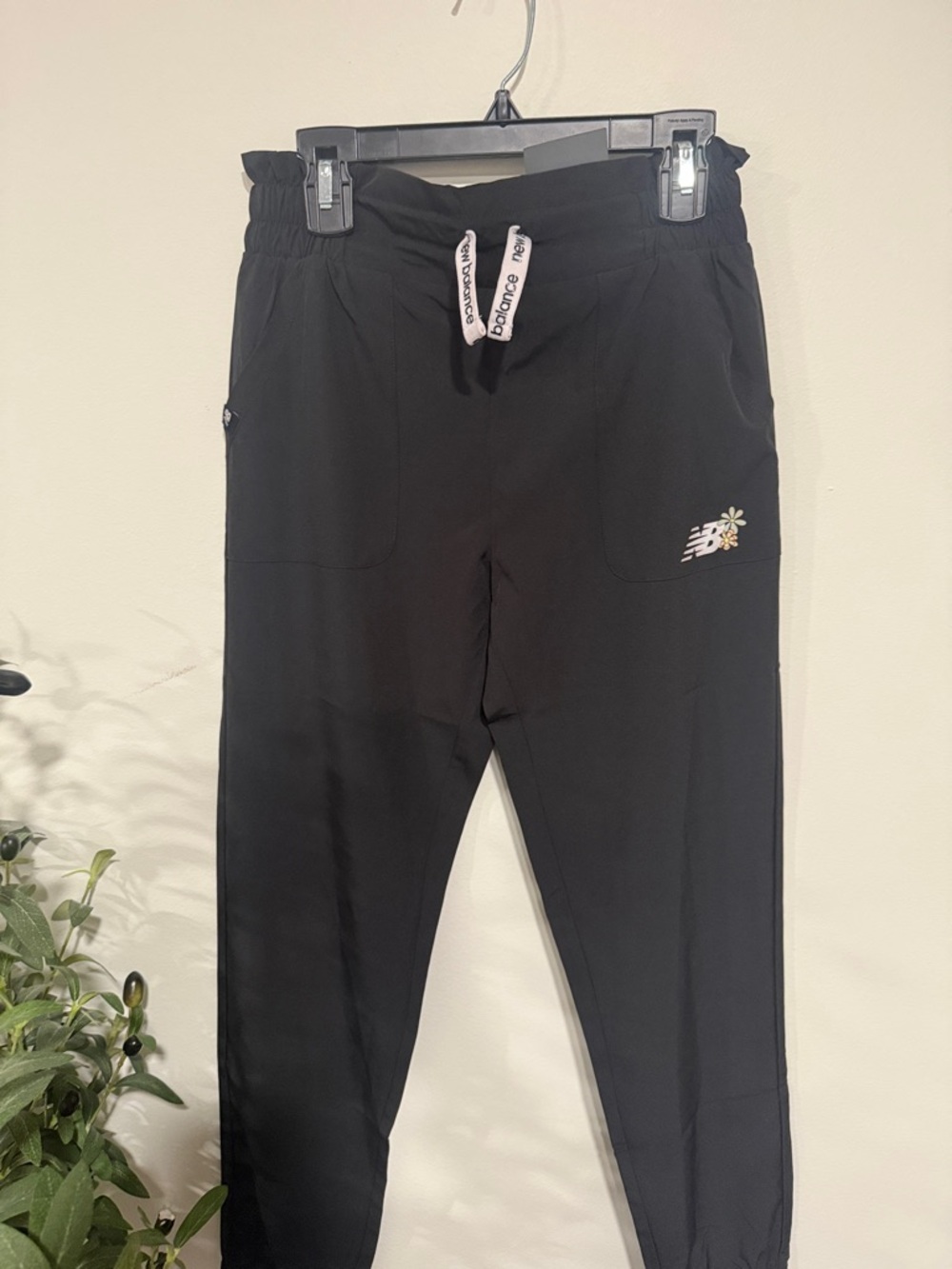 New Balance Black Jogger Pants with White Drawstrings and Daisy Accent
